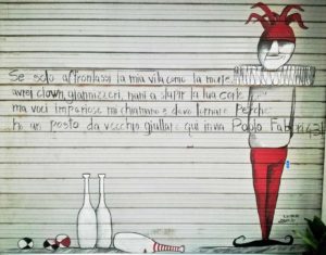 versi di guccini sulle saracinesche dei negozi in cirenaica a bologna